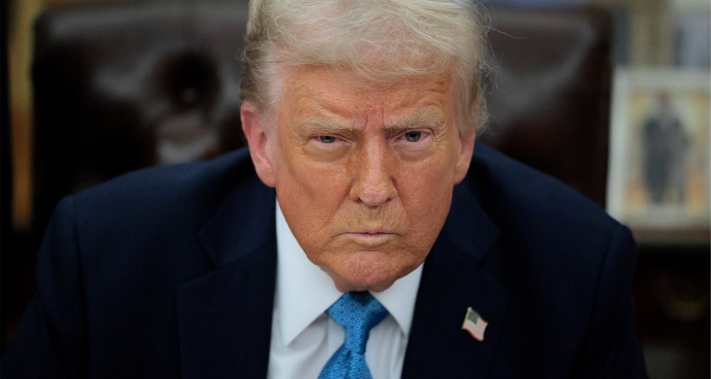 U.S. President Donald Trump talks to reporters after signing an executive order, "Unleashing prosperity through deregulation," in the Oval Office on January 31, 2025 in Washington, DC.