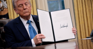 President Trump holding his Executive Order on tariffs on Jan 31 2025