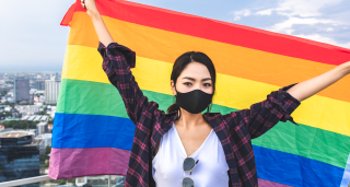 Asian woman with LGBT flag
