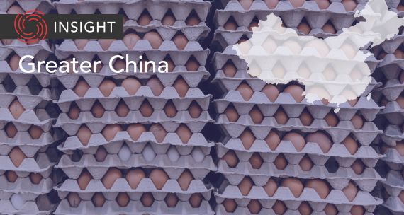 Stack of egg cartons on Greater China banner