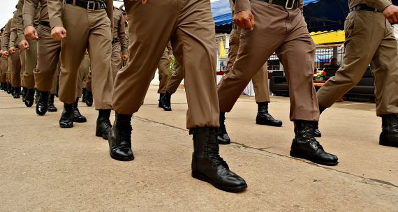 Thai Police March Along Street