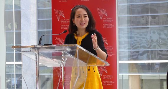 Woman speaking at podium