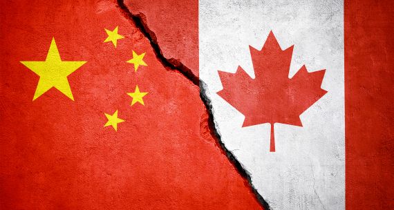 Image of China and Canada flags with fracture line 