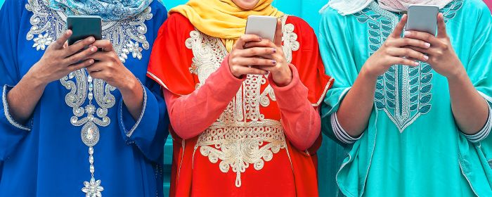 Indonesian women on mobile phones