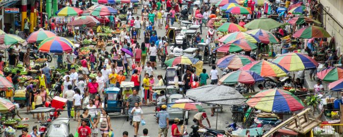 People gathered at a market in the Philippines